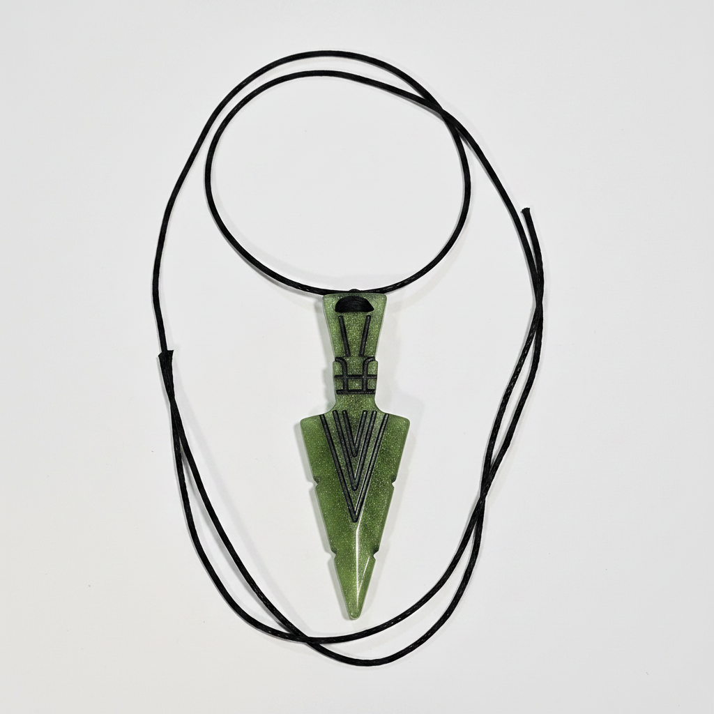 Green resin arrowhead pendant necklace on white background