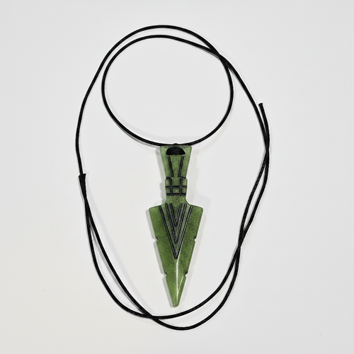 Green resin arrowhead pendant necklace on white background